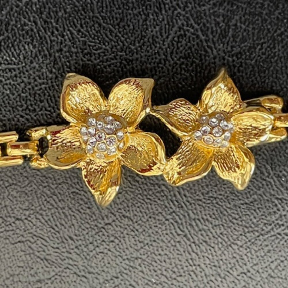 Vintage gold tone bracelet-two flowers-Clear stones on center of flowers